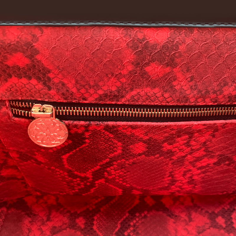 Inner red canvas snakeskin embossed lining with custom gold zipper pull